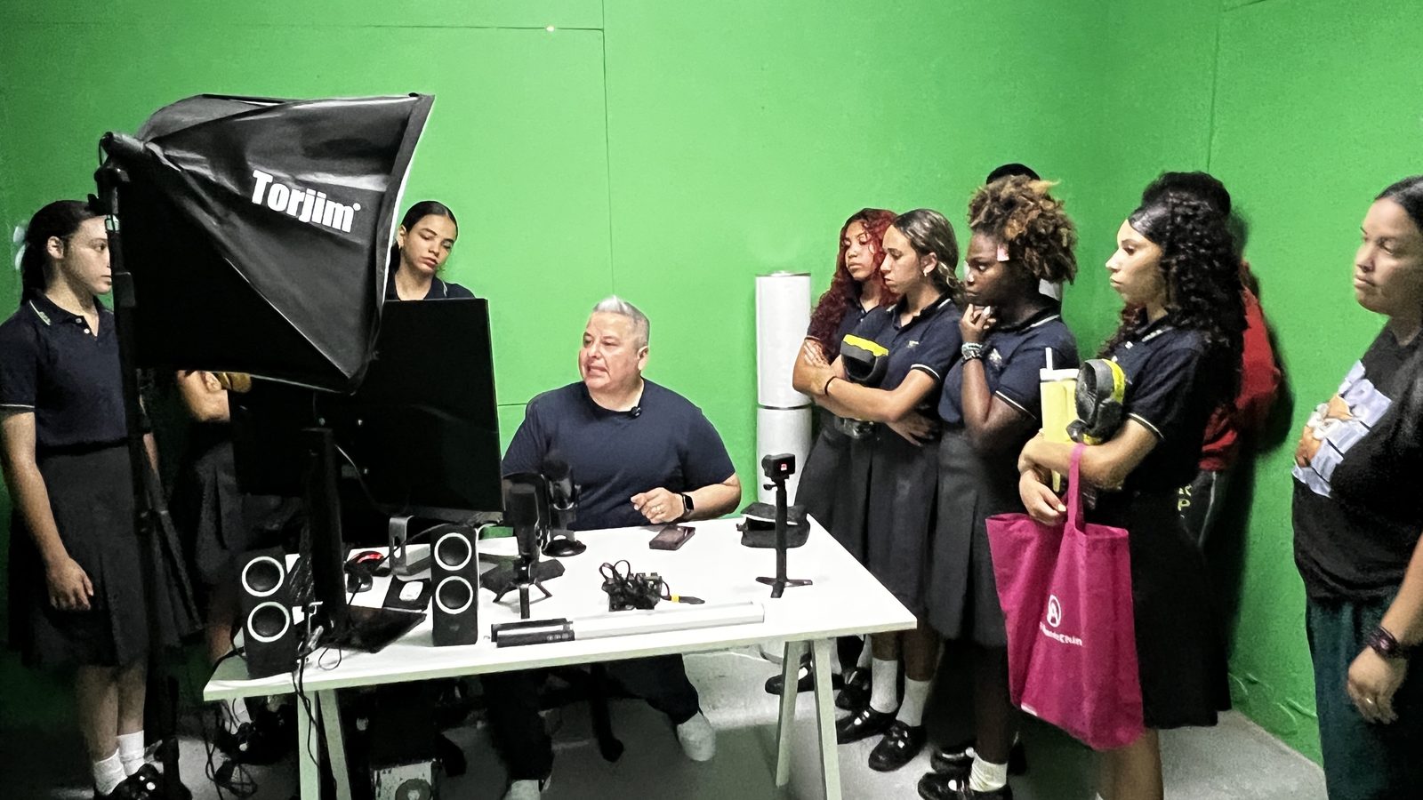 Students learning video production in a school media studio