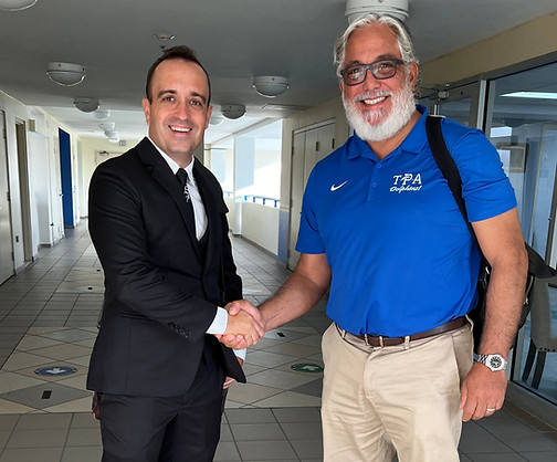 A Tech My School partnership handshake with a school leader
